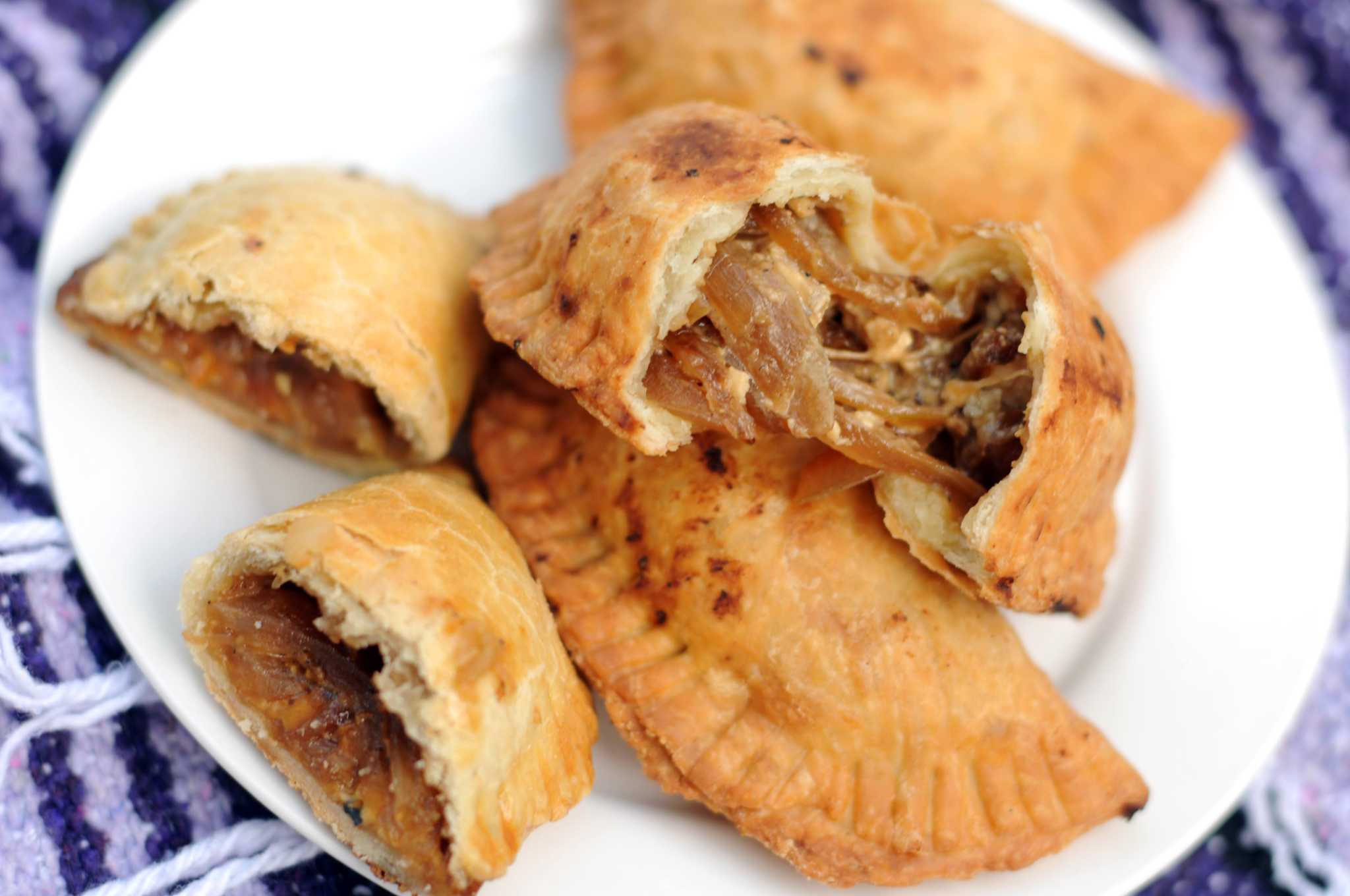 Empanadas stuffed with blue cheese and caramelized onions are a unique form of empanada popular in Argentina.
